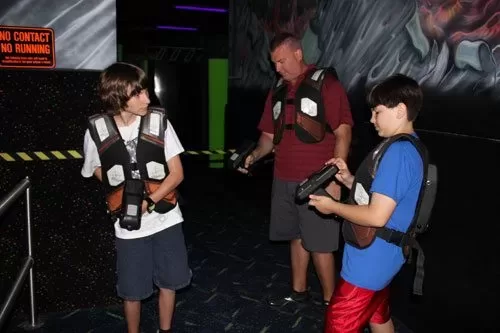 laser-tag Family preparing to play laser tag inside WonderWorks Orlando.