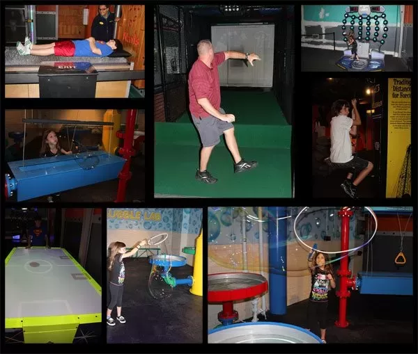 wonder-works-orlando Family trying hands-on exhibits inside WonderWorks Orlando, including bubbles, games, and physical challenges.
