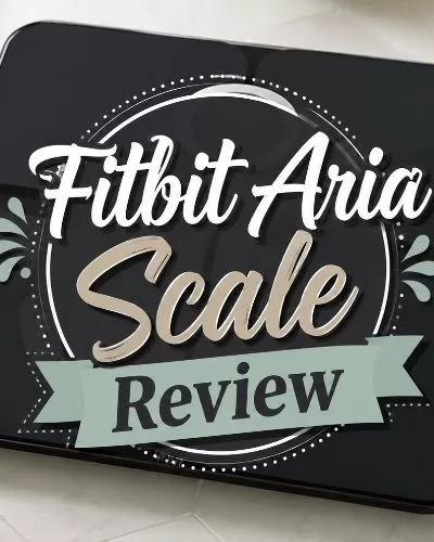 Black Fitbit Aria smart scale with centered decorative text that reads Fitbit Aria Scale Review.
