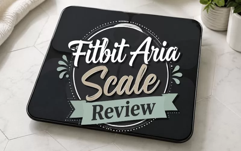 Black Fitbit Aria smart scale with centered decorative text that reads Fitbit Aria Scale Review.
