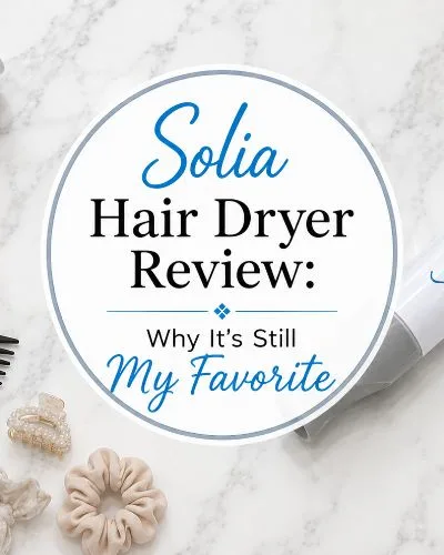 Solia hair dryer with concentrator nozzle on a white marble countertop.