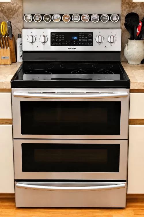 Close-up of the Samsung Dual Cook oven with dual-door design and smooth cooktop