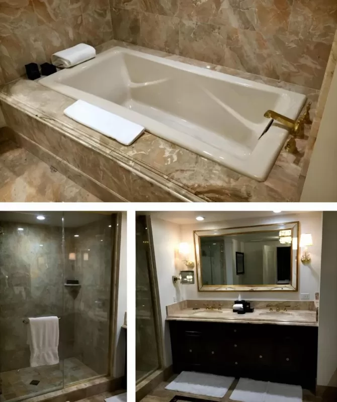 Bathroom in the Trump Doral villas with a soaking tub, glass shower, marble tile, and vanity.