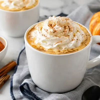 Homemade pumpkin spice latte with real pumpkin, whipped cream, and pumpkin pie spice