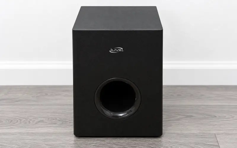 Black iLive wireless subwoofer with front bass port on gray flooring
