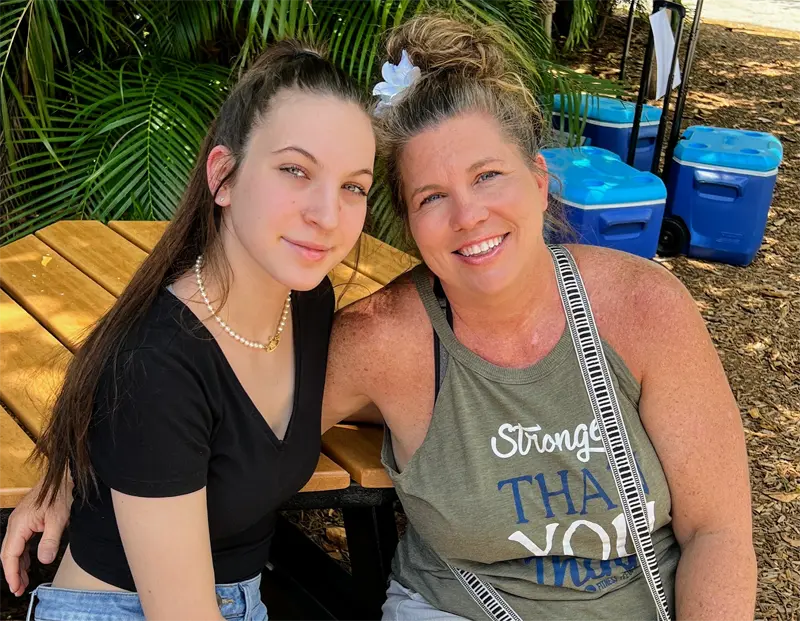 Wearing a Fitness Tee Co tank top casually while spending time outdoors