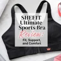 Black high-impact sports bra surrounded by gray dumbbells, a rolled towel, water bottle, and workout accessories with the title “SHEFIT Ultimate Sports Bra Review: Fit, Support, and Comfort.”