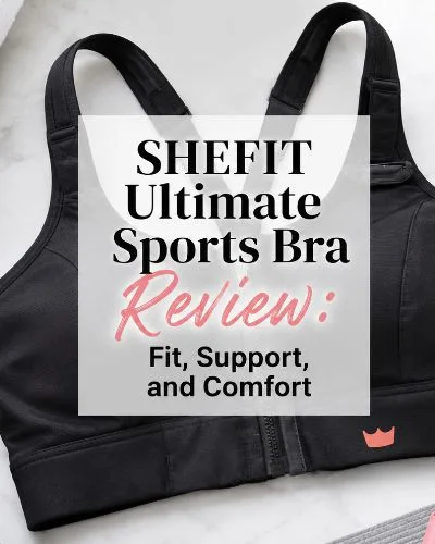 Black high-impact sports bra surrounded by gray dumbbells, a rolled towel, water bottle, and workout accessories with the title “SHEFIT Ultimate Sports Bra Review: Fit, Support, and Comfort.”