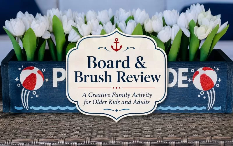 Poolside wooden flower box filled with white tulips with centered title text for a Board & Brush review.