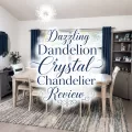Crystal dandelion chandelier above an updated dining room with grey furniture, blue curtains, and elegant decor.