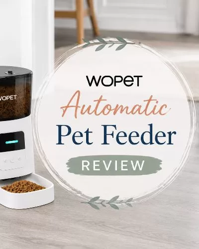 WOPET automatic pet feeder on grey wood flooring with decorative text that reads WOPET Automatic Pet Feeder Review.