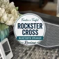 Fender x Teufel ROCKSTER CROSS speaker with a centered review title graphic on an outdoor table