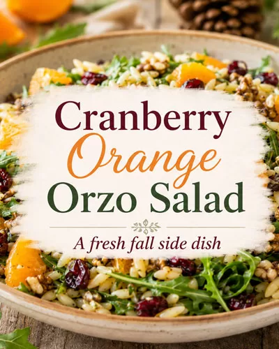 Cranberry orange orzo salad with dried cranberries, orange segments, walnuts, and arugula with a centered recipe title graphic