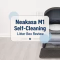Neakasa M1 Self-Cleaning Litter Box Review featured image showing the automatic litter box in a home setting with a centered product review title graphic.