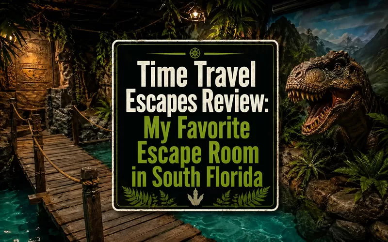 Jurassic-themed escape room image with a wooden bridge over blue fake water, jungle walls, tropical plants, a dinosaur, and centered text reading Jurassic Adventure Complete Review.