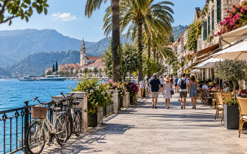Walking and Sightseeing Image — After “Explore the Destination on Foot”
Alt Text: Travelers walking along a scenic waterfront path while sightseeing on vacation.
Title: Staying Active Through Vacation Sightseeing
Description: A walkable waterfront destination where exploring shops, cafés, and scenery naturally adds activity to a vacation day.
4. Resistance Band Image — After “Pack a Resistance Band”
Alt Text: Resistance bands packed inside an open suitcase with vacation clothing and travel essentials.
Title: Resistance Bands for Vacation Workouts
Description: Lightweight resistance bands tucked into vacation luggage as a simple option for short workouts while traveling.